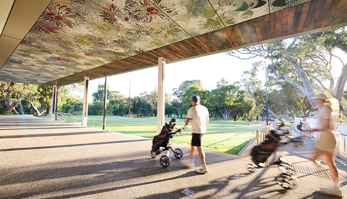 Visitors of Hamersley Public Golf Course walking underneath the public artworks