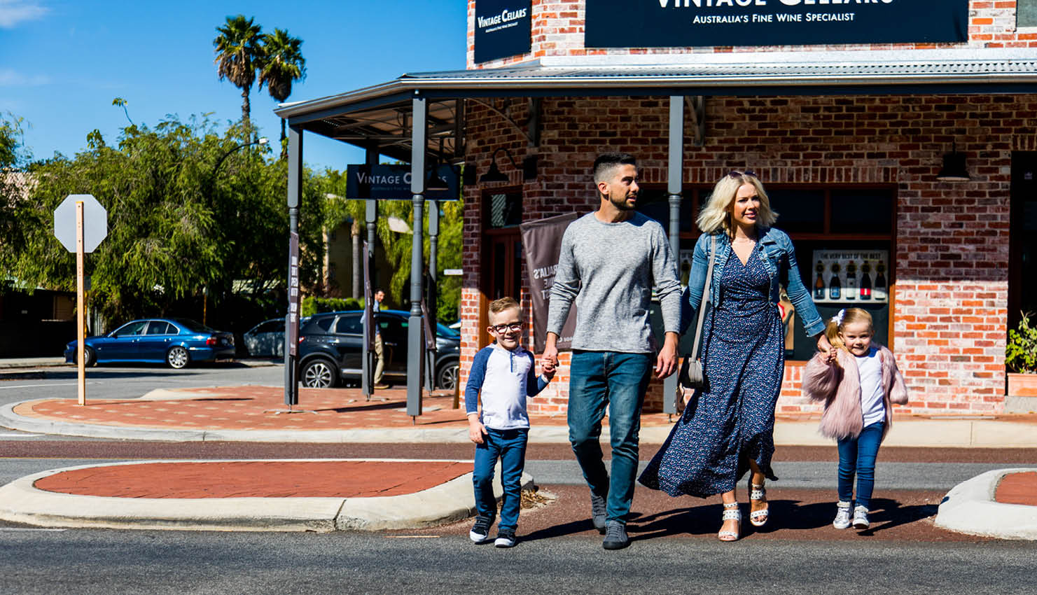 Image of family crossing the street safely