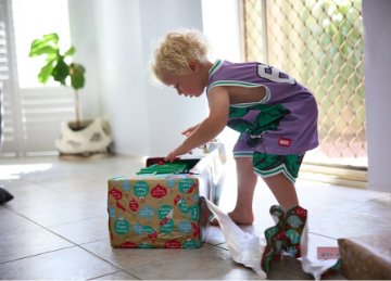 Hemsley opening his new garbage truck on Christmas Day. 