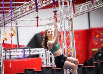 Image of girl doing the Ninja obstacle course. 